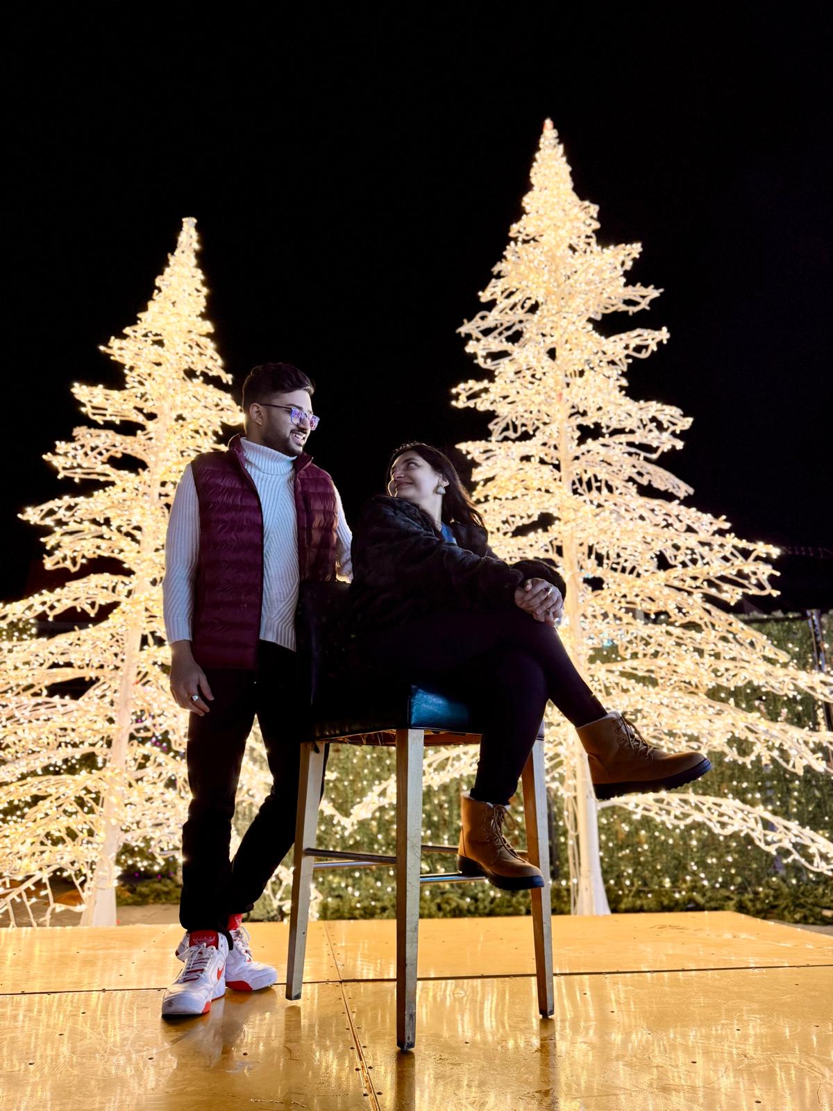 Priyank and Binny under Christmas lights